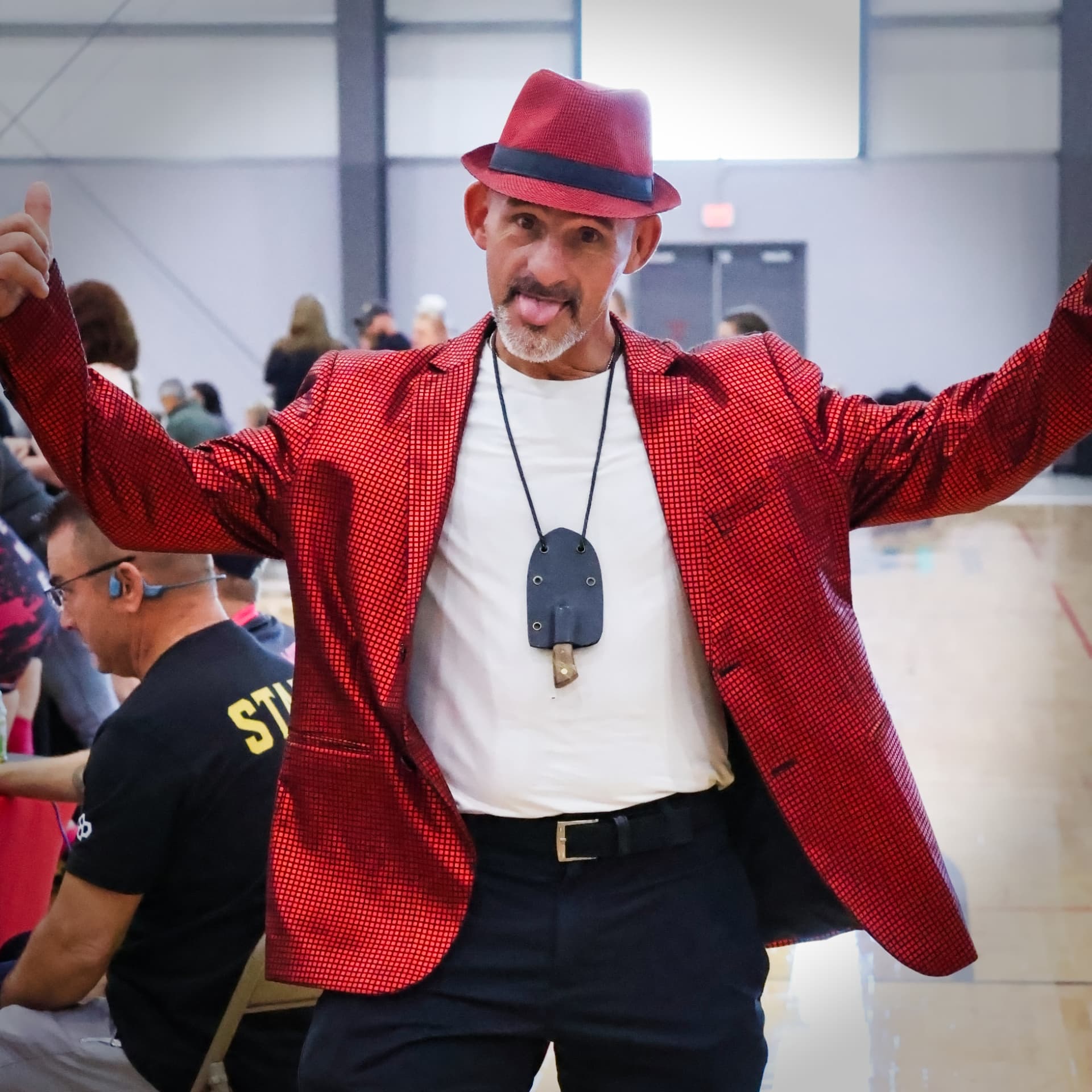 Jason DeLois in his red jacket at War of the Roses